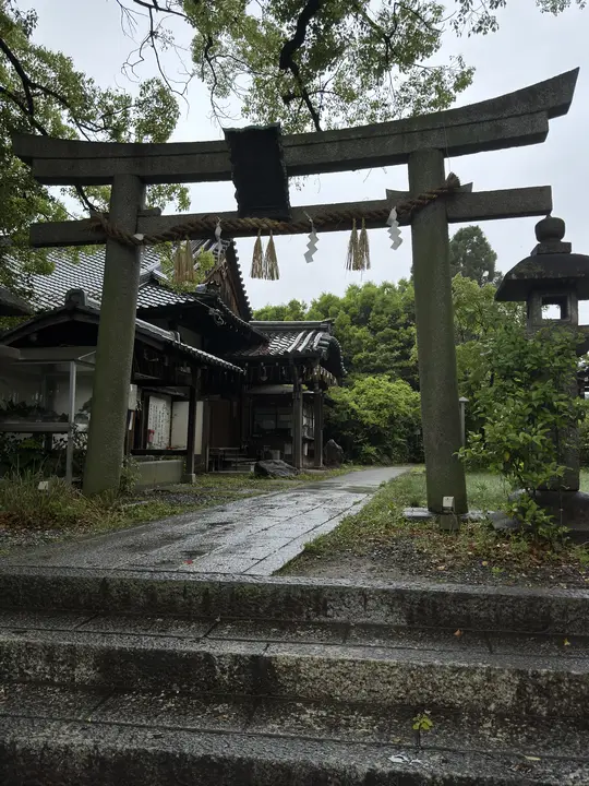 Stone torii beside a pond