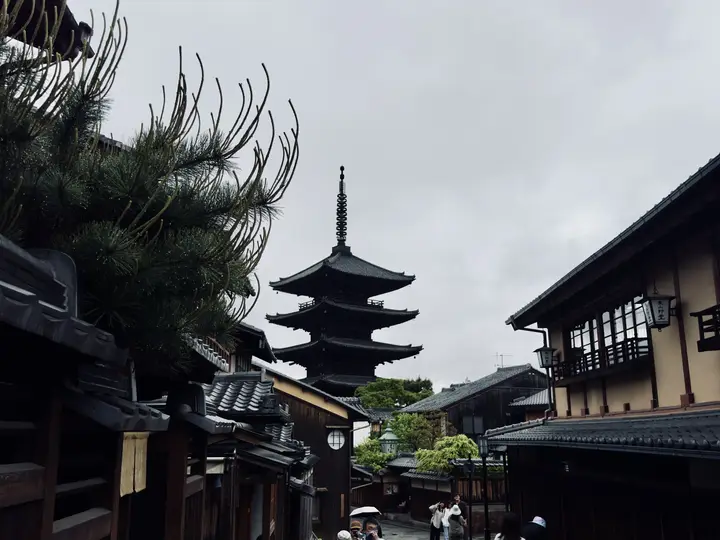 Pagoda above the rooftops of an old street