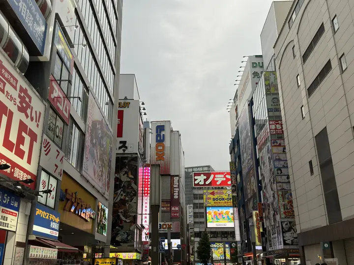 Street of signs under a cloudy sky