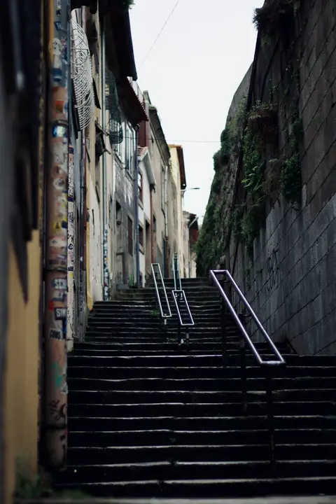 Stairs between old stone walls
